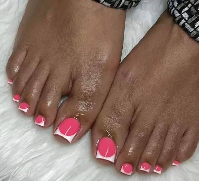 Pink gel polish pedicure with a neat glossy finish