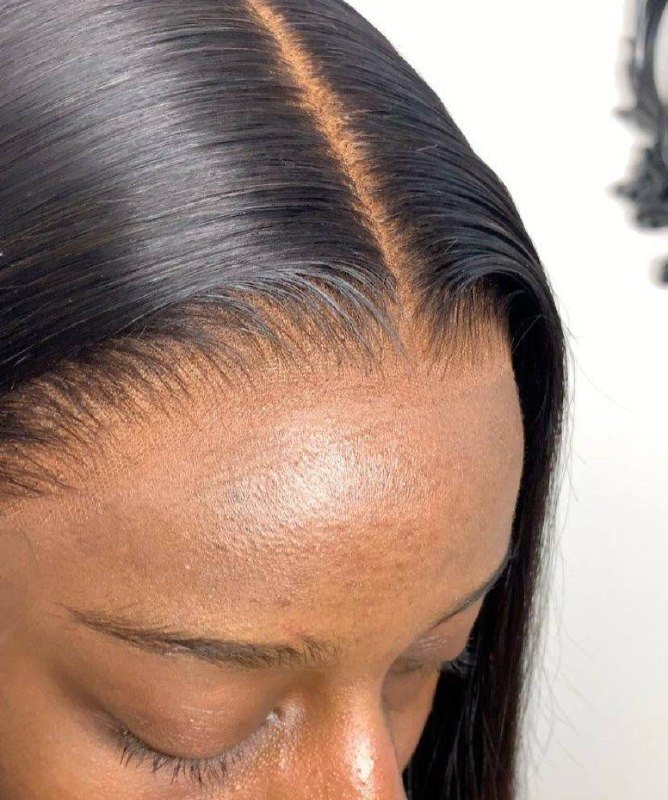 Sleek, dark wig installation from the Lioness portfolio